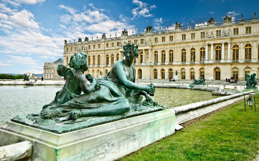 Sculpture,In,The,Garden,Of,Chateau,De,Versailles,With,Blue