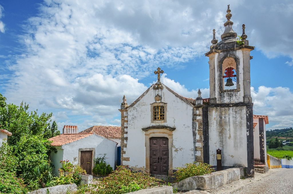 Church,In,Obidos,,Portugal,,On,Cloudy,Sky