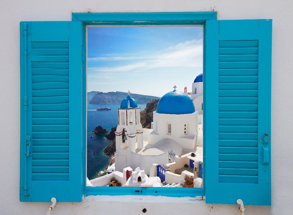 Window,With,View,Of,Caldera,And,Classical,Church,With,Blue