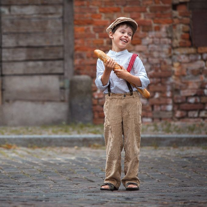 Cheerful,Smiling,Boy,With,Baguette,Outdoors Cheerful,Smiling,Boy,With,Baguette,Outdoors