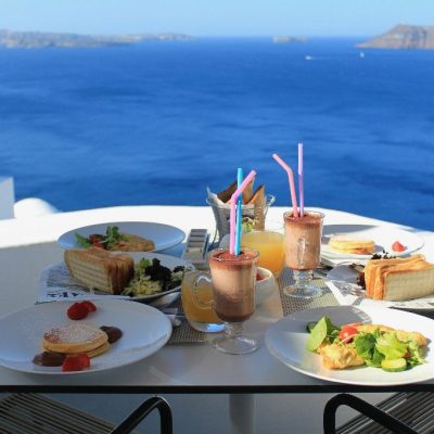 Breakfast,On,A,Terrace,Overlooking,The,Sea,In,Oia,,Santorini,