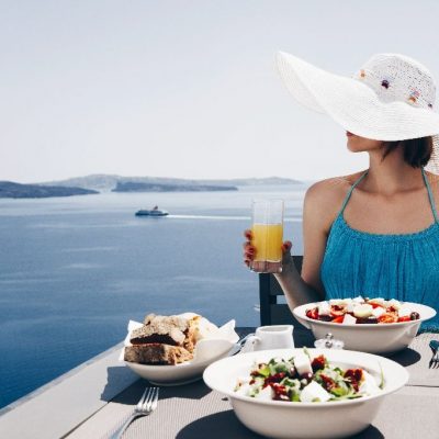 Vacation.,Holidays.,Eating.,Young,Woman,In,Dress,And,Hat,Is