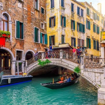 Narrow,Canal,With,Gondola,And,Bridge,In,Venice,,Italy.,Architecture