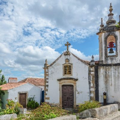 Church,In,Obidos,,Portugal,,On,Cloudy,Sky